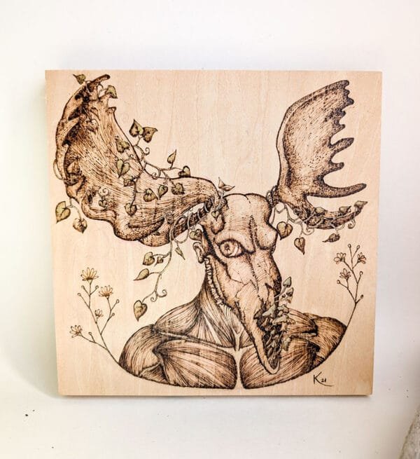 Woodburned animal skull on wood