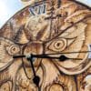 Wood burned Clock Front Closeup of details on a wood burned clock